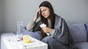 woman sick from either common cold or flu