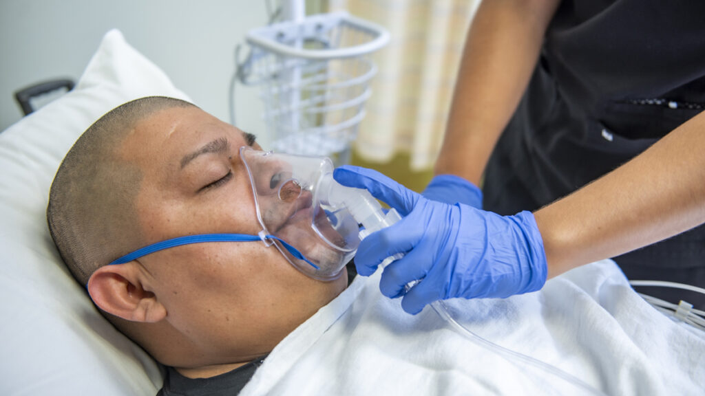 a patient on bed receiving immediate care at Access Total Care