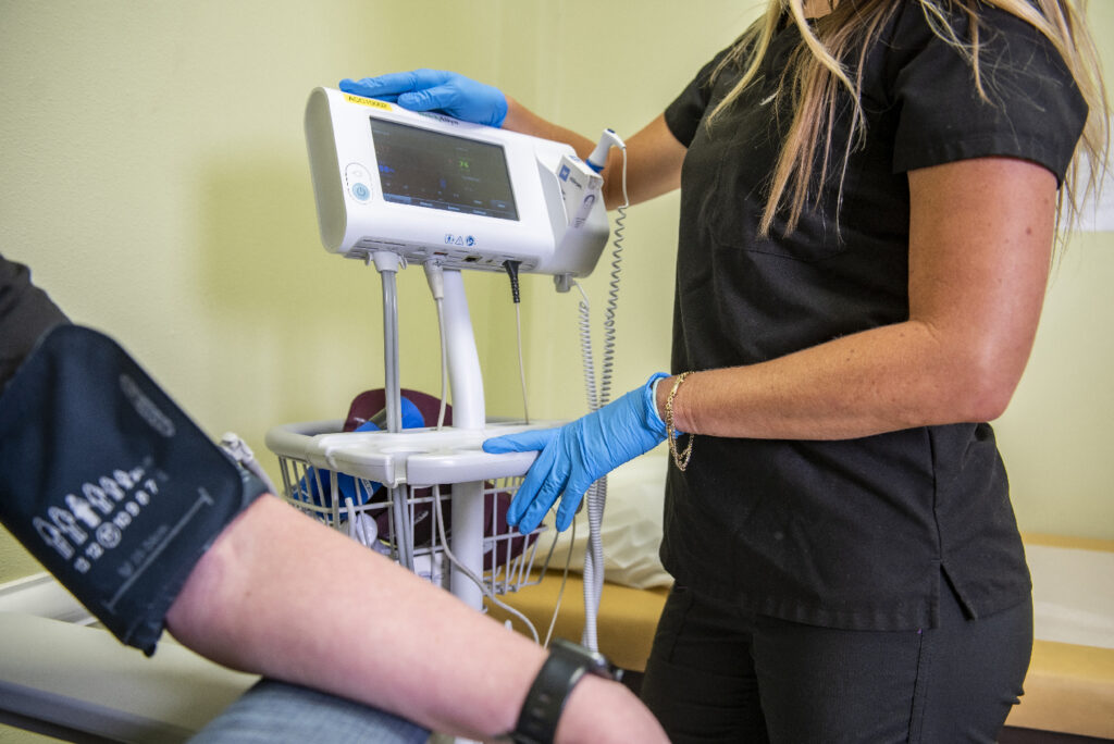 nurse taking vitals during patient urgent care