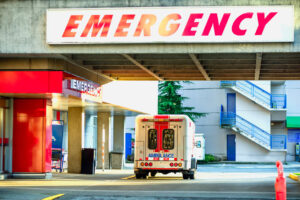 ambulance car parked near the emergency entrance to the hospital