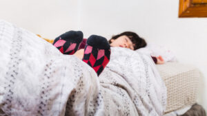 an image of a child enjoying a deep winter sleep in her comfy bed