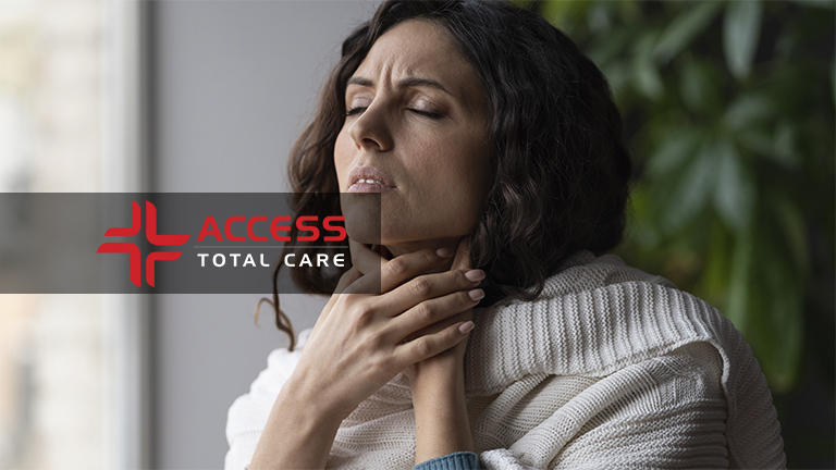 sick woman in pain holding her sore throat from cold and virus, saore throats